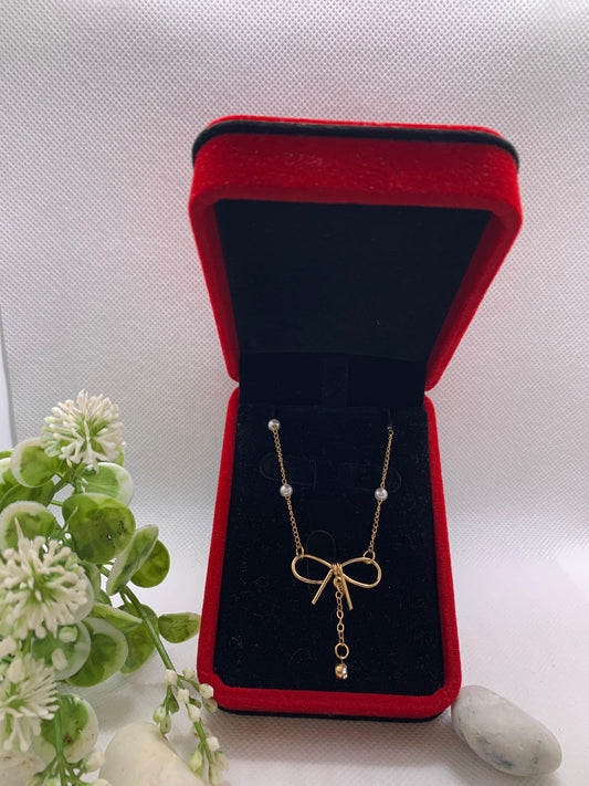 💎 Collier Doré avec Nœud Élégant et Perles Fines 💎