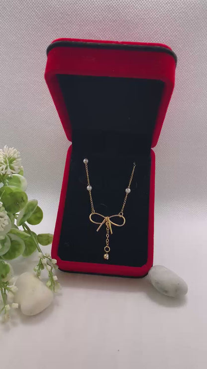 💎 Collier Doré avec Nœud Élégant et Perles Fines 💎